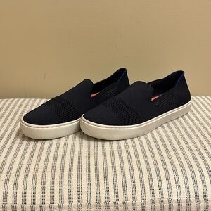 Rothy’s navy slip on sneakers with orange insert